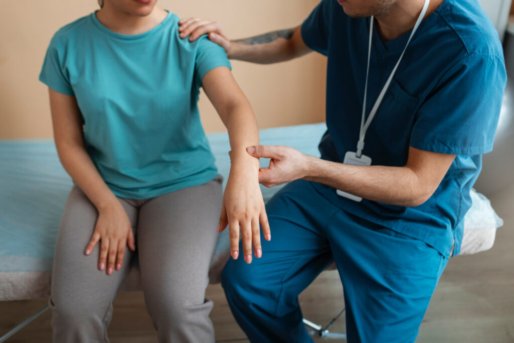 doctor consulting a patient who has a joint pain