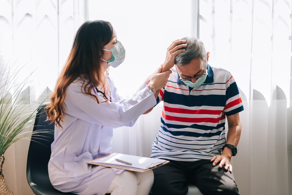 A doctor helping someone with a headache.