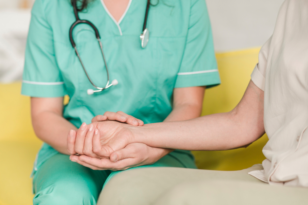 A doctor consoling a patient.