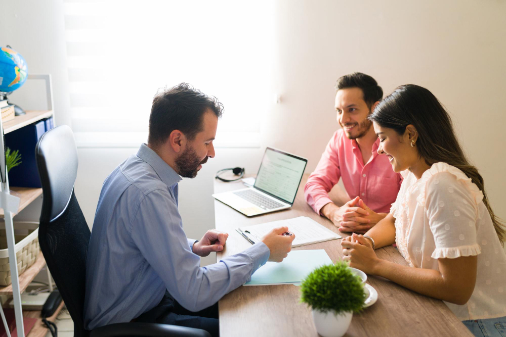 A doctor consulting a couple.